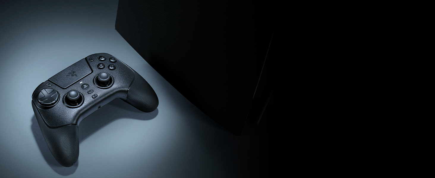Close-up of gaming equipment including what appears to be a black controller against a dark background.