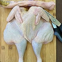 Roasting chicken prepare with shears 