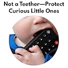 Baby Toddler chewing on a remote control