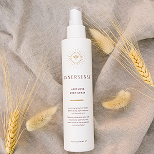 Hair Love Prep Spray on a rustic background.