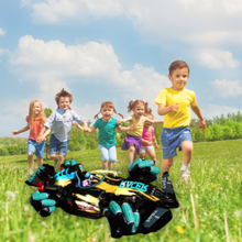 Children running in grass and race car