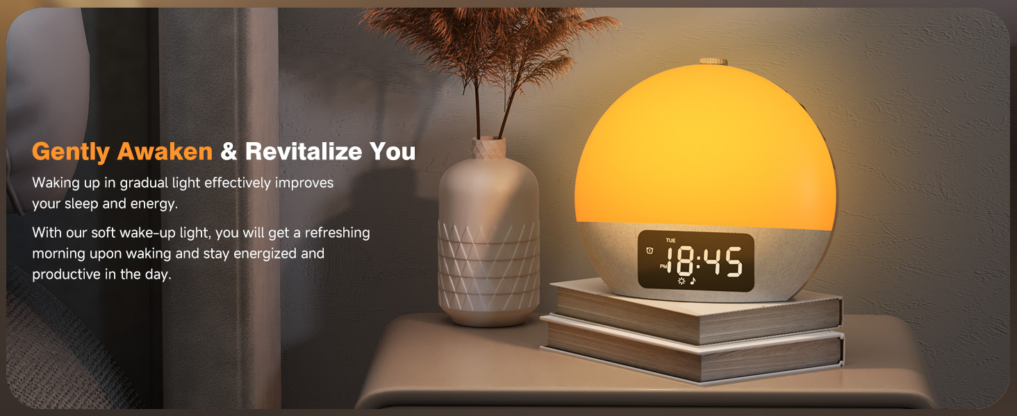 Sunrise alarm clock with dome-shaped yellow light. Digital time display on wooden base. Text describes gentle wake-up function. Shown on nightstand with decorative items.