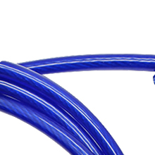 Close-up of curved, bright blue plastic or rubber tubing. The flexible material has a smooth, glossy surface and appears to be hollow.