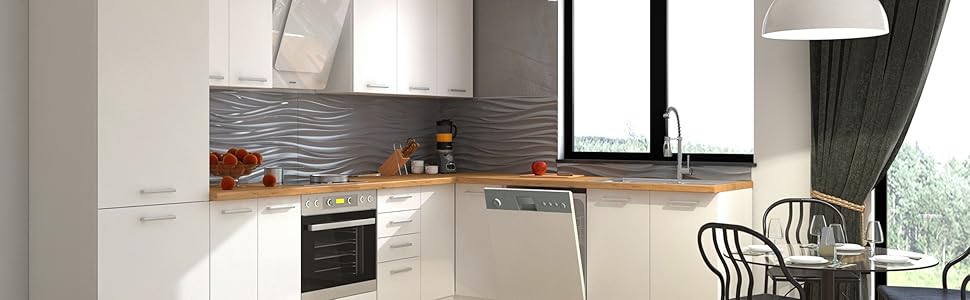 Modern white L-shaped kitchen with wooden floor, stainless steel appliances, pendant lights, and a small dining area with black chairs.