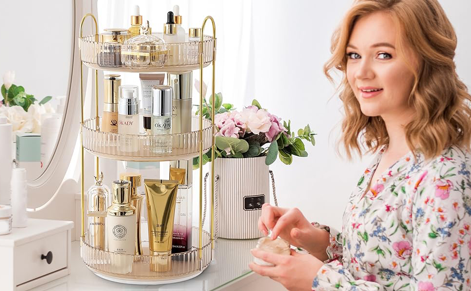 360-degree rotating cosmetic organizer in gold and clear acrylic, featuring multiple tiers for storing beauty products with decorative metallic frame design.