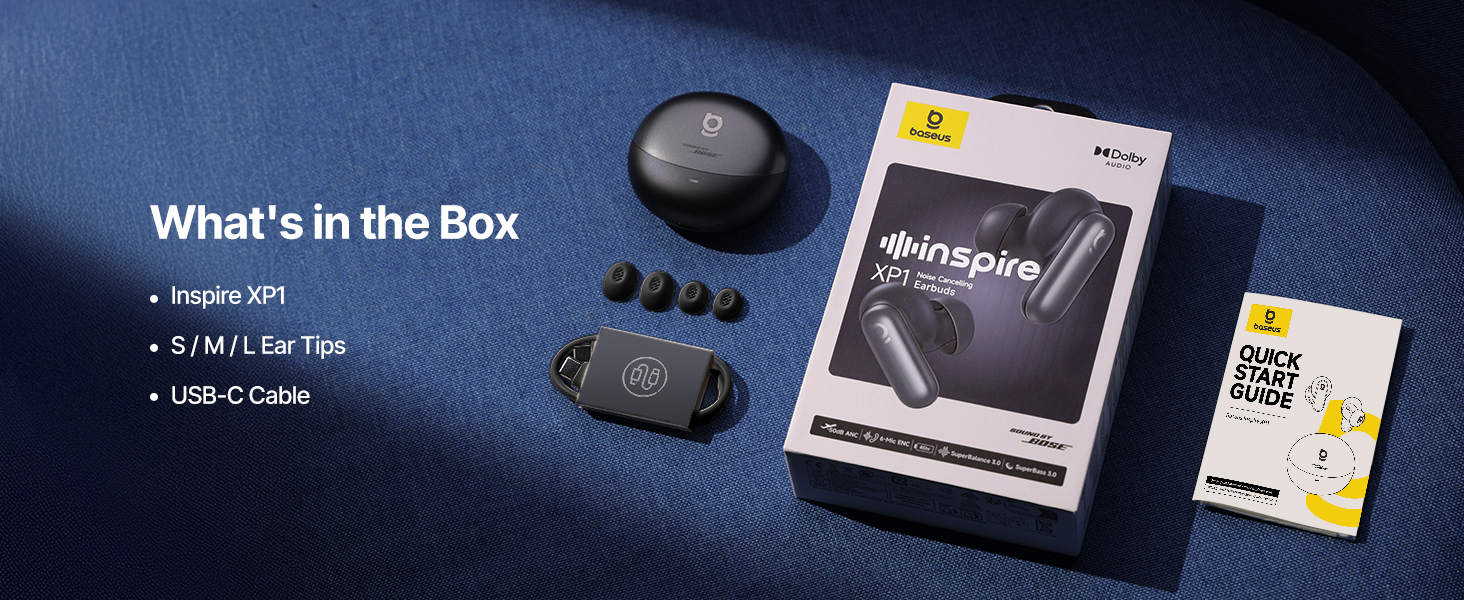 Product packaging and contents display showing electronic device components and accessories laid out against a dark blue background with product literature.