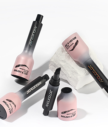 Makeup products featuring black and pink gradient packaging. Set includes blush and highlighter tubes, a liquid eyeliner pen, and a makeup brush with white bristles.