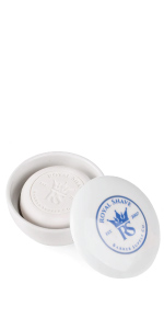 lemon sandalwood puck soap in lidded bowl