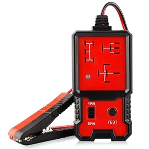 Red and black automotive electrical circuit tester. Compact device with digital display, test probes, and labeled ports for various testing functions.