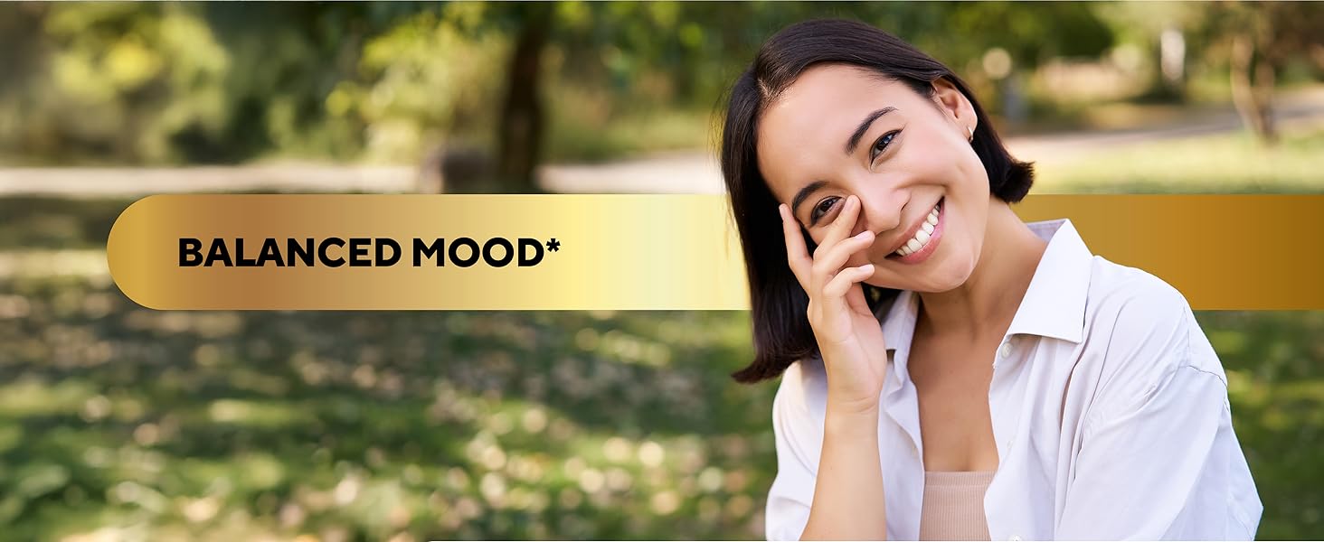 woman in white shirt smiles with green trees on the background and mood balance background text