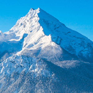 A giant frozen snow covered mountain scene.