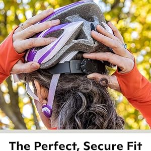 Hands adjusting a bicycle helmet on a person's head. Outdoor setting with trees in background. Text describes secure fit and easy adjustment.