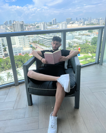 Picture of Aaron, one of the founders, on a Miami balcony