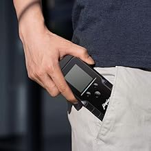 Sequence showing a compact black device being inserted into or removed from a pants pocket, demonstrating its portability.