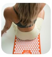sitting on acupressure mat