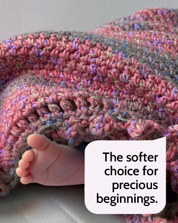 baby feet poking from knitted blanket