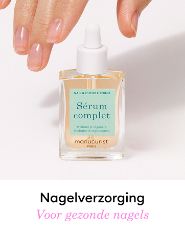Glass bottle of nail and cuticle serum with dropper cap. Hand holding bottle, demonstrating application. Label reads 'Sérum complet' by Manucurist Paris. Product for nail care.