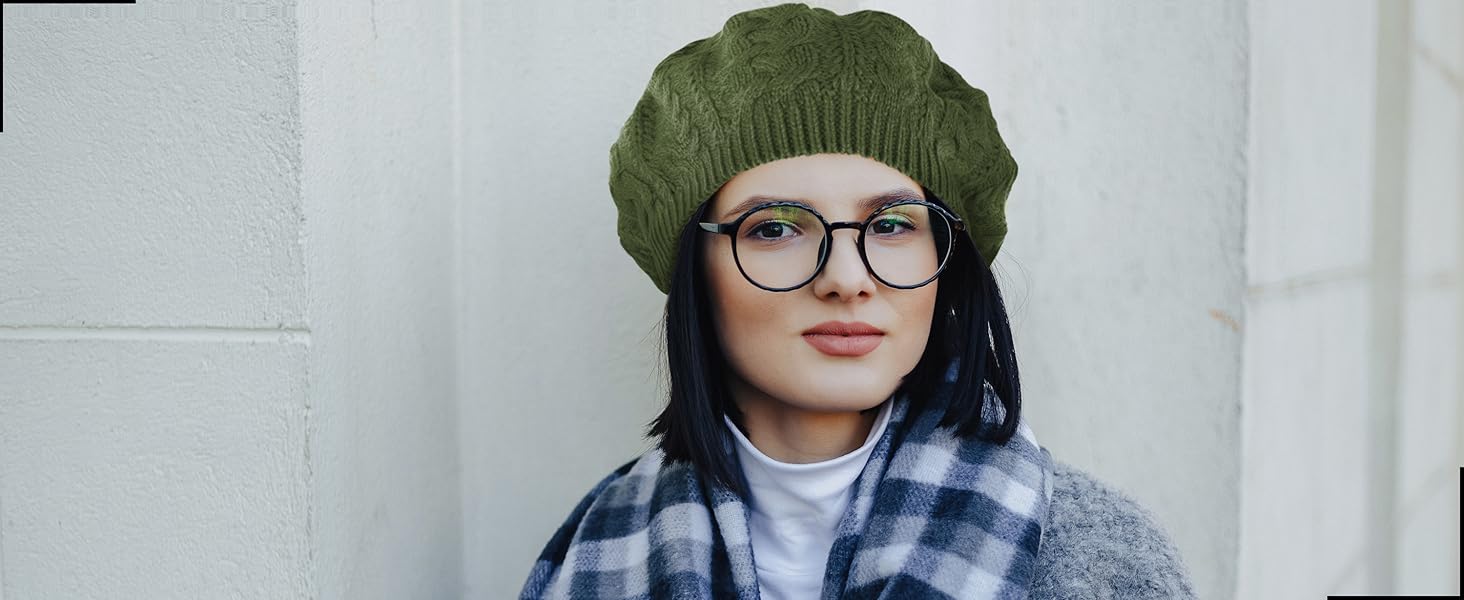 lady wearing a green crochet beanie with glasses