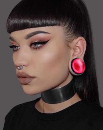 girl with ear plugs and choker