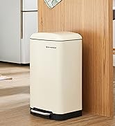 Cream-colored rectangular pedal waste bin with black trim at base, shown against wooden panel wall in home setting.