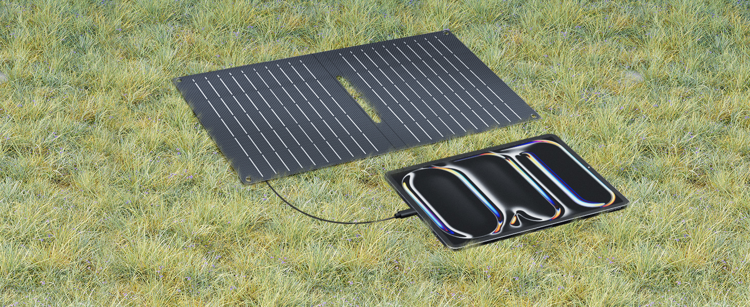 Portable solar charging pad with three connected black panels, shown unfolded on grass. One panel features ribbed solar cells surface while others appear smooth.