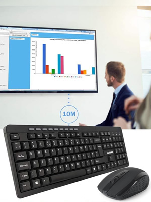 Wireless keyboard and mouse set with a person presenting data on a large screen in the background. Keyboard features full-size layout with numeric keypad.