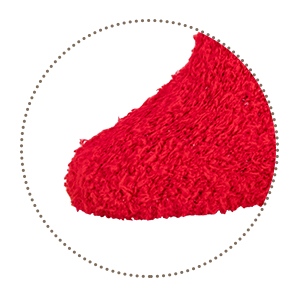 Close-up of a bright red textured material or fabric with a plush, fluffy appearance, shown in a circular frame.
