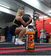 protein sports drink in foreground, athlete working out in the background