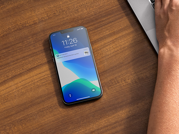 the iphone x is on a wooden table