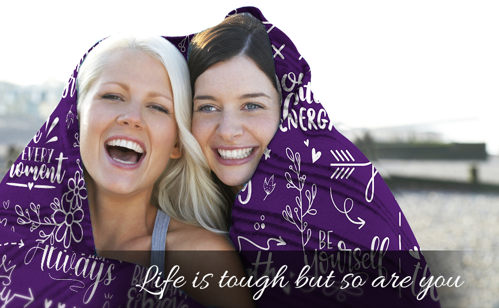 Two happy women hugging in Vprintes blanket with a quote of inspiration