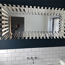 customer image of Starburst large rectangular wall mirror hung horizontally in modern bathroom