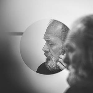 adult man in the mirror