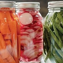 Photo of canned carrots, radishes, and green beans.