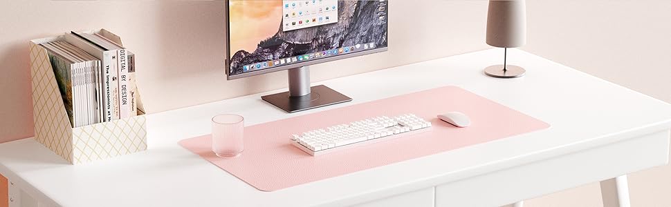 a pink mouse pad on a desk