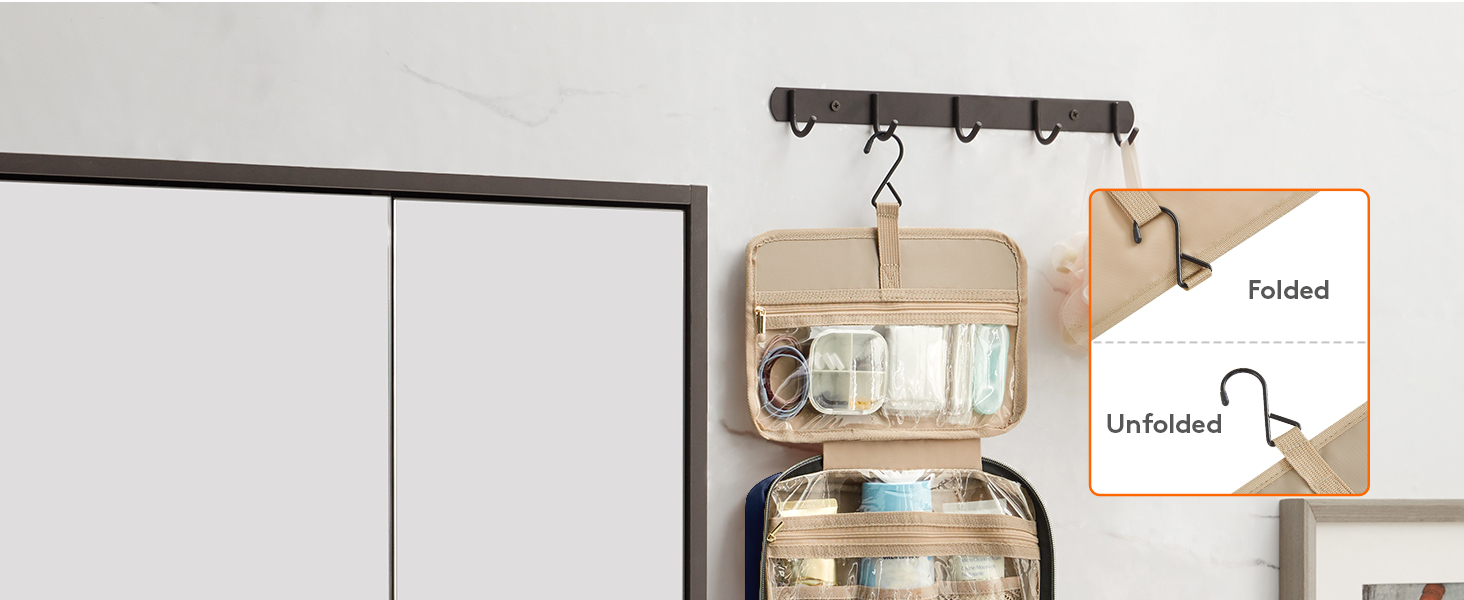 Wall-mounted key holder with hooks and hanging organizer pouch. Rustic wooden design with metal hooks for keys and small items.