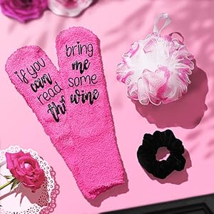 Cozy comfort essentials including a set of plush socks, a shower loofah, and a velvet scrunchy