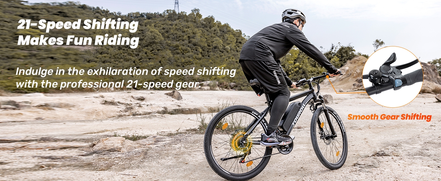 Mountain bike on rugged terrain featuring 21-speed shifting system, shown in action shot with emphasis on gear shifting capabilities