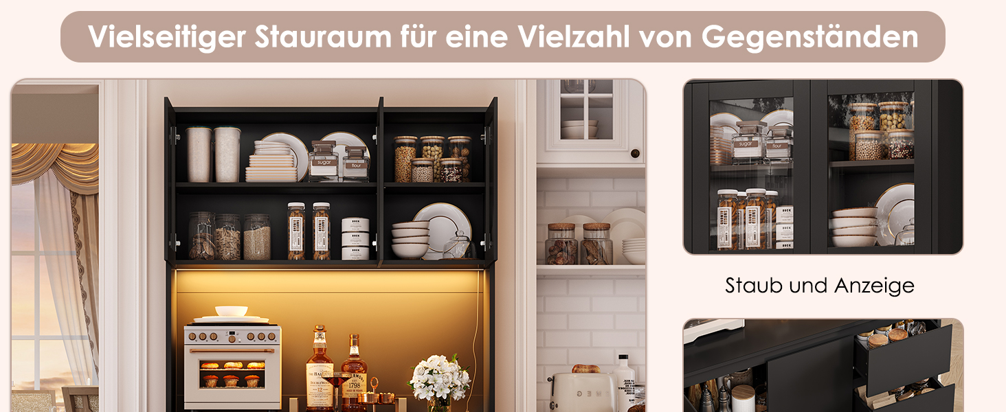 eine Küche mit einem schwarzen Schrank und einer weißen Wand.