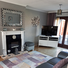 customer image of Starburst rectangular wall mirror hung horizontally in modern living room