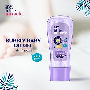 Text reads 'my little miracle', 'BUBBLY BABY OIL GEL', 'calm & soothe', 'mild & gentle'. Purple bottle of baby oil gel product with tropical leaf decorative elements.