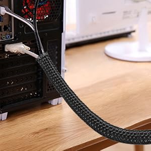 a close up of a black cable connected to a computer.