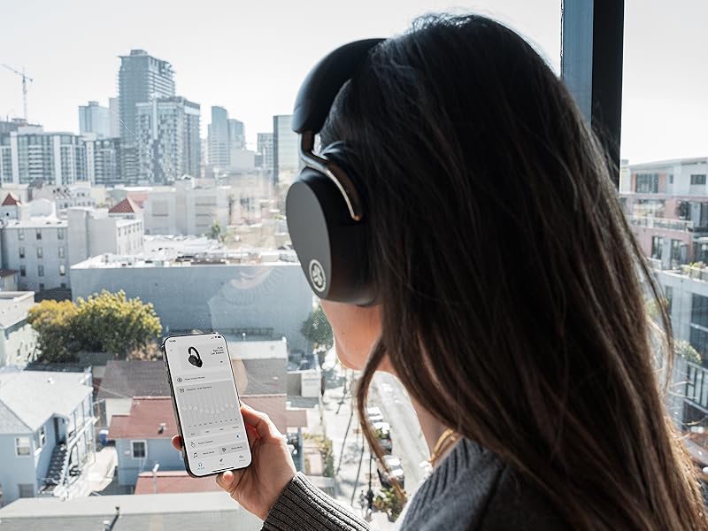 Woman using the jlap app with epic lux anc headphones