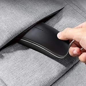 a hand that is holding a mouse in a suit.