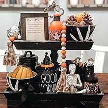 spooky season fall tiered tray with hocus pocus sign skeleton decor and pumpkins mug