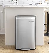 Stainless steel rectangular step trash can with brushed finish and pedal-operated lid, shown in kitchen setting against white cabinetry.