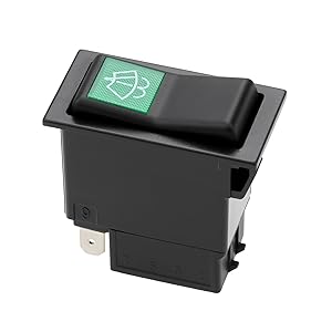 Black rectangular rocker switch with illuminated green light icon showing fan/ventilation symbol.