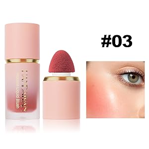 Pink cylindrical makeup product with gold accent and red sponge applicator. Close-up of eye with pink-tinted makeup applied to cheek area.