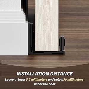 Door stopper installation guide showing proper placement. Text instructs to leave 5.5-30 millimeters under door. Close-up of stopper against light wood door and dark wood floor.