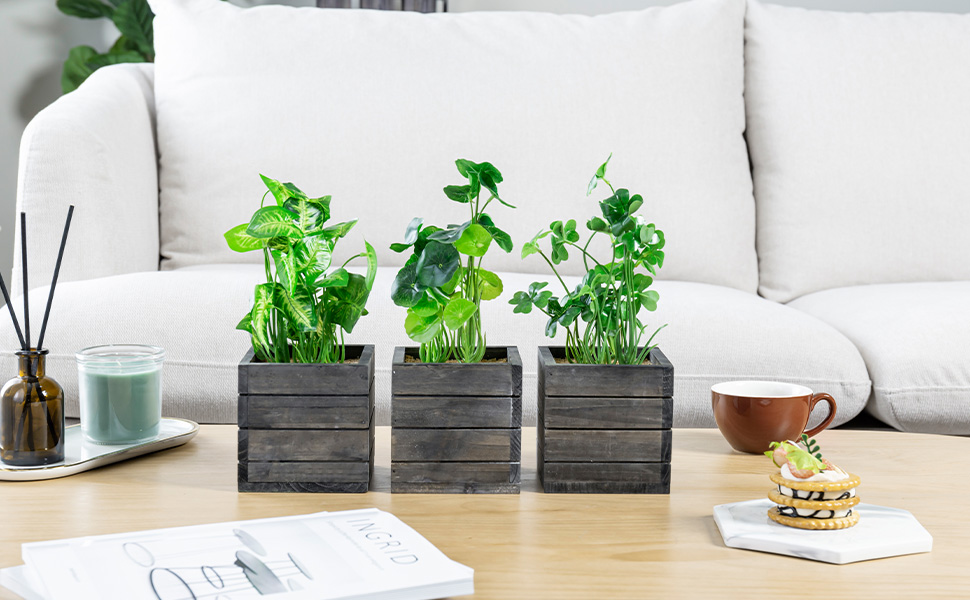 faux plants in grey wooden planter boxes