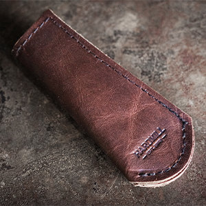 pan handle cover cast iron lodge sleeve leather handmade usa protective cooking cook oven heat grill